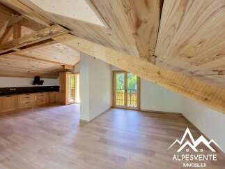 Experience rustic charm in this spacious attic apartment, featuring a beautifully exposed wooden beam ceiling and warm wood finishes throughout.
