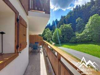 Enjoy breathtaking mountain views from this charming balcony, perfect for al fresco dining or morning coffee.