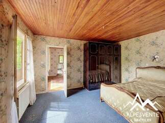 Discover this charming bedroom featuring a spacious wardrobe and a comfortable bed, perfect for a cozy retreat.