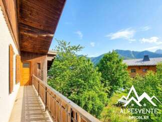 Experience breathtaking mountain views from this charming wooden balcony, perfect for enjoying your morning coffee or evening relaxation.