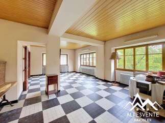 Step into this charming room featuring a striking black and white checkered floor that adds a unique character to the space.