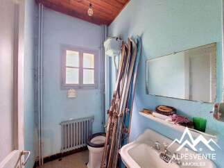 Discover a charming bathroom with a vintage feel, featuring a classic sink and toilet.