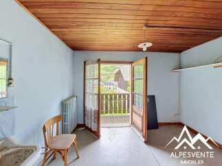 Step out onto the charming balcony from this cozy room, offering picturesque views of the surrounding village and mountains.