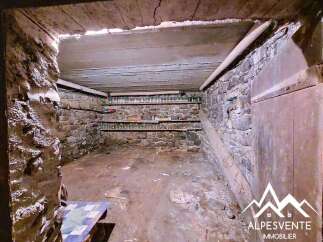 Discover the potential of this rustic stone cellar, perfect for storage or conversion.