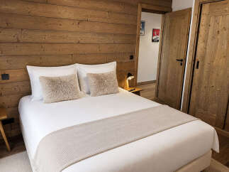Experience rustic charm and modern comfort in this beautifully appointed bedroom.