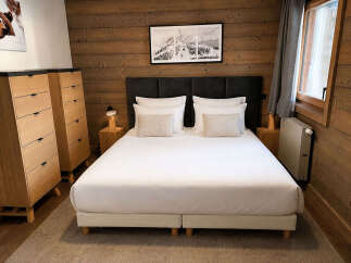 Experience rustic charm and modern comfort in this beautifully appointed bedroom.