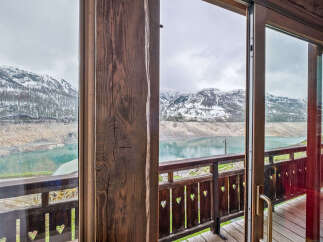 Experience breathtaking mountain and lake views from this charming property.