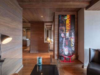 Experience luxurious living in this stunning property featuring warm wood paneling throughout, creating a cozy and inviting atmosphere.