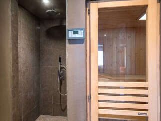 Experience ultimate relaxation with this luxurious spa-like bathroom featuring a modern walk-in shower with sleek tilework and a rainfall showerhead.