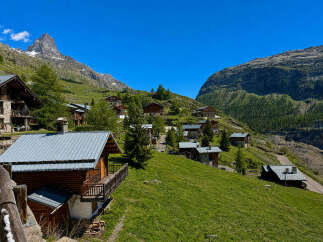 Discover this charming alpine village nestled amidst breathtaking mountain scenery.