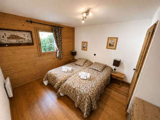 This charming bedroom features two comfortable twin beds, perfect for accommodating guests or family.