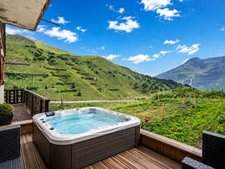Experience ultimate relaxation with this stunning mountain view hot tub, perfect for unwinding after a day of adventure.