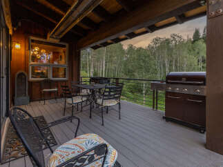 Enjoy outdoor living at its finest on this spacious deck, perfect for entertaining or relaxing amidst nature.
