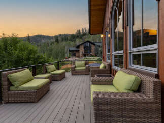 Enjoy breathtaking mountain views from this expansive deck, perfect for entertaining or relaxing.