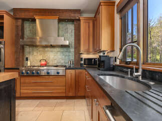 Experience rustic charm and modern convenience in this beautifully appointed kitchen.