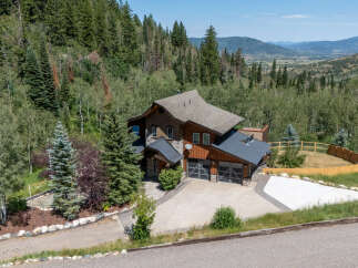 Nestled amidst a serene mountain landscape, this stunning property offers breathtaking panoramic views.