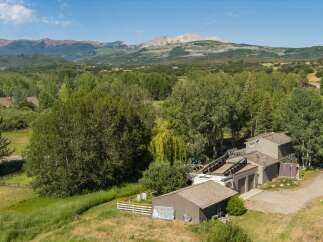 Nestled amidst lush greenery and rolling hills, this property offers a serene mountain retreat.