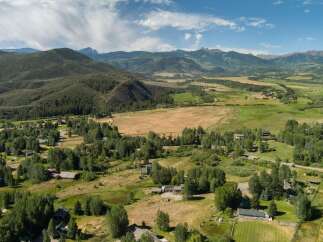 Discover this stunning property nestled amidst rolling hills and majestic mountains, offering a serene escape.