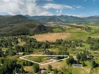 Discover this stunning property nestled amidst rolling hills and majestic mountains, offering a serene escape.