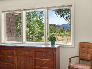 Enjoy breathtaking mountain views from this charming room, featuring a large bay window that floods the space with natural light.