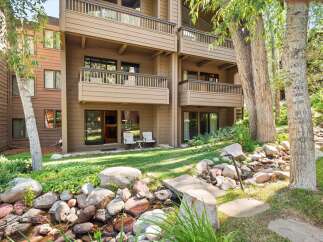 Enjoy the serene mountain setting of this property, featuring a charming creek and lush greenery.