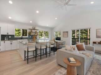 Experience modern living in this stunning open-concept home, featuring a gourmet kitchen with a spacious island perfect for entertaining.