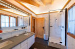 Experience modern comfort in this beautifully appointed bathroom, featuring a spacious double vanity with sleek countertops and ample storage.