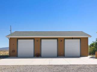 Discover ample storage and parking with this spacious three-car garage, perfect for any homeowner.