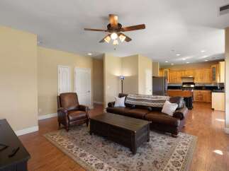 This inviting living space features a comfortable leather sofa and armchair, perfect for relaxation.