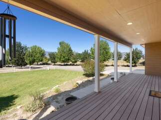 Enjoy the serene mountain views from this expansive covered porch, perfect for relaxing or entertaining.