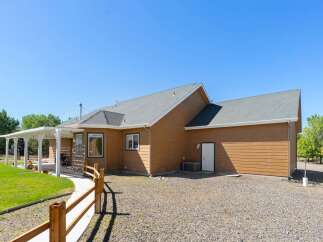 Discover this charming home featuring a spacious covered patio, perfect for outdoor entertaining and enjoying the serene surroundings.
