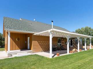 Enjoy outdoor living with this spacious covered patio, perfect for entertaining or relaxing.