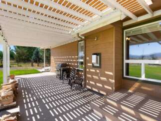 Enjoy outdoor living with this covered patio, perfect for entertaining or relaxing.