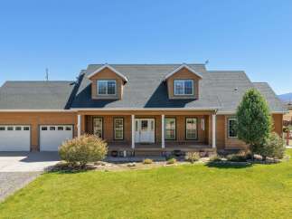 Discover this charming home featuring a welcoming front porch perfect for enjoying the outdoors.