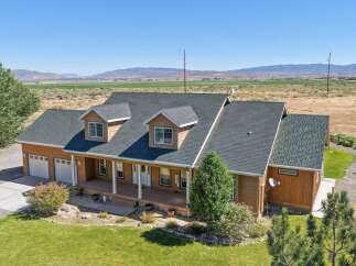 Discover this charming home featuring a spacious wrap-around porch perfect for enjoying the scenic views.