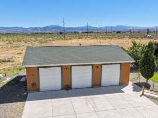 Discover ample storage and parking with this spacious three-car garage, perfect for vehicles, hobbies, or equipment.