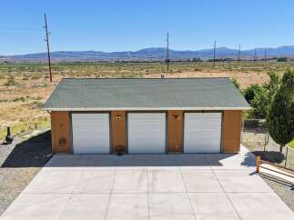 Discover ample parking and storage with this spacious three-car garage, perfect for vehicles, hobbies, or equipment.