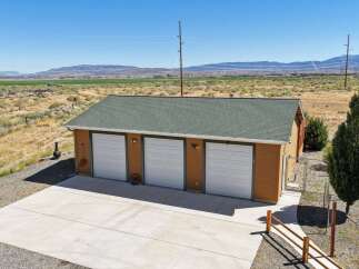 Discover this charming property featuring a spacious three-car garage, perfect for vehicles and storage.