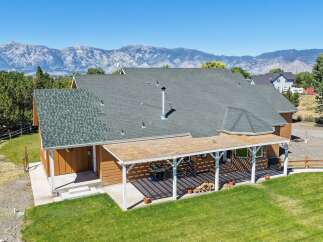 Experience breathtaking mountain views from this stunning property, featuring a spacious covered patio perfect for outdoor entertaining.
