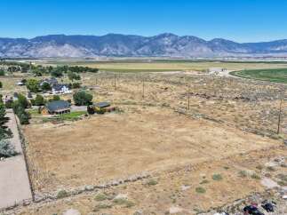 Discover this expansive rural property offering a unique blend of residential comfort and agricultural potential.