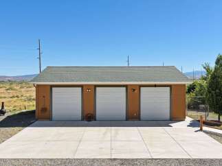 This property features a spacious three-car garage with ample room for vehicles and storage.