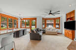 Experience comfortable living in this inviting space, featuring a spacious living area with plush seating and a large TV for entertainment.