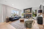 Experience luxury living in this stunning living room, featuring a modern sectional sofa and plush armchairs perfect for relaxation.