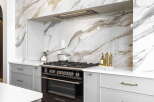 Experience luxury in this modern kitchen, featuring a stunning marble backsplash that adds a touch of elegance.