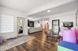 Discover this spacious and versatile living area, perfect for both relaxation and fitness.