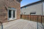 Step outside onto this expansive wooden deck, perfect for entertaining or relaxing.