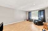 Discover comfort and style in this inviting living space, featuring a plush leather recliner perfect for relaxation.