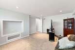 Discover this spacious basement living area, perfect for entertainment and relaxation.