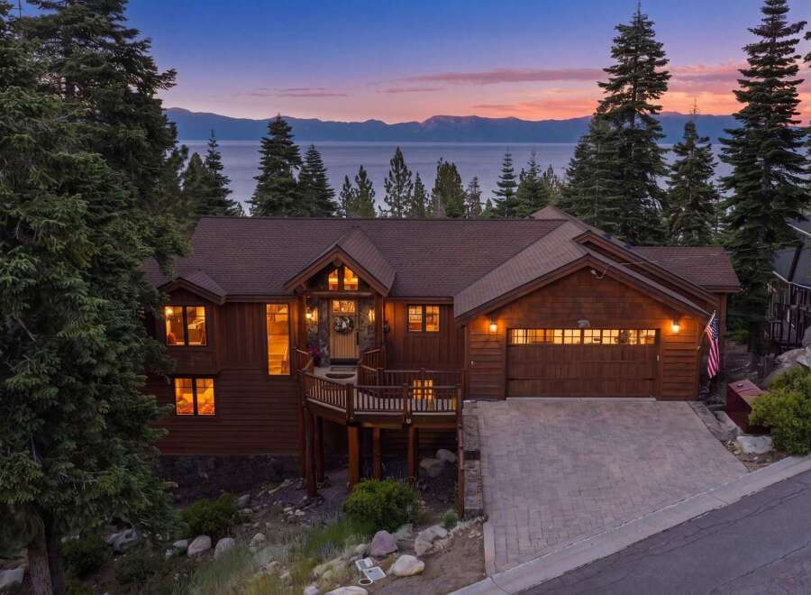 Experience luxury living in this stunning mountain home with breathtaking lake views.