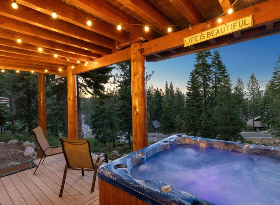 Experience ultimate relaxation in this stunning mountain retreat, featuring a luxurious hot tub perfect for unwinding under the stars.